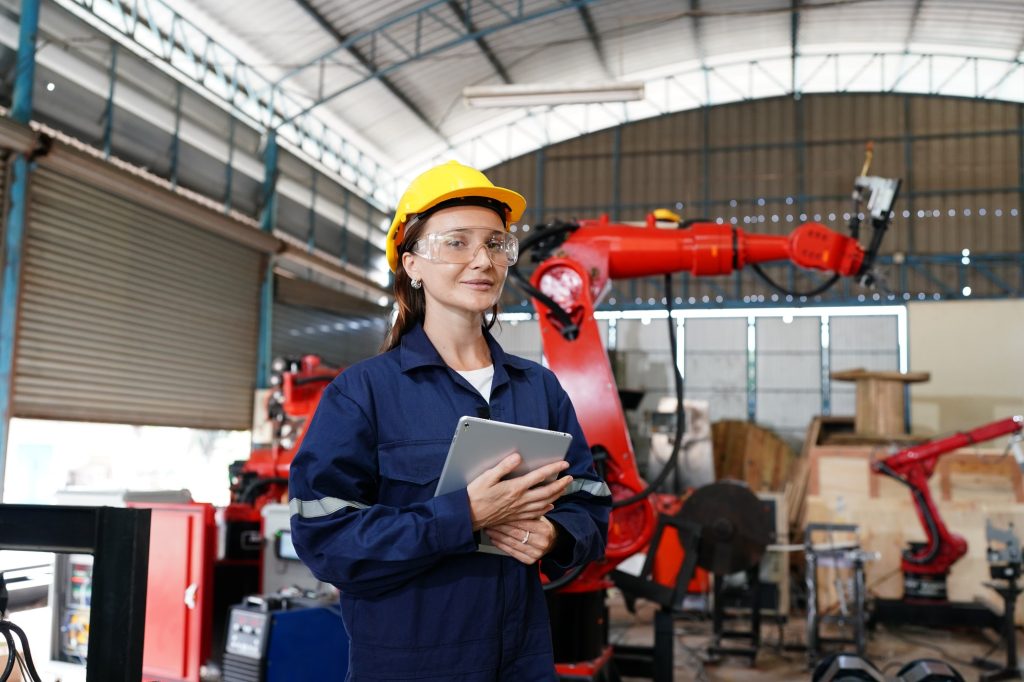 Engineers working in an industrial production facility