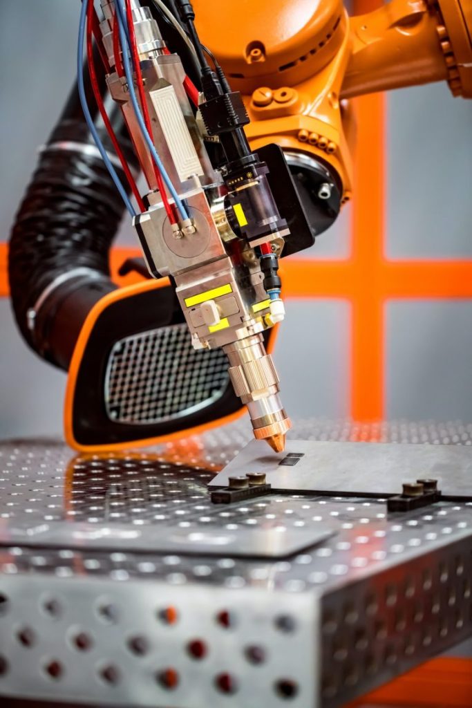Robotic laser cutting system in industrial production