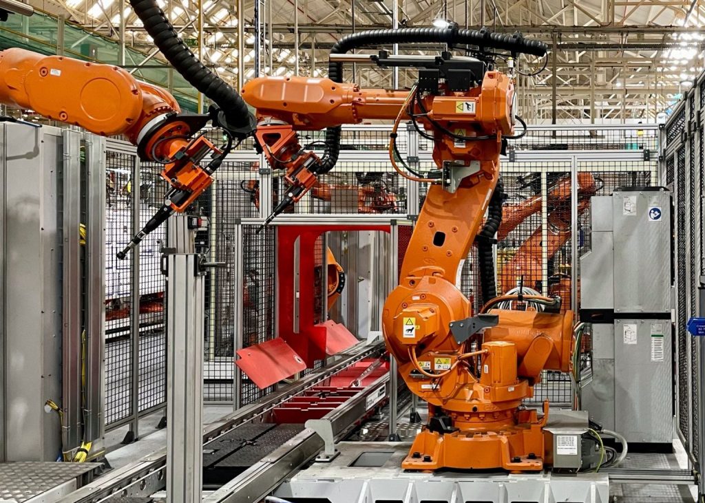 Industrial robots in an automated manufacturing facility